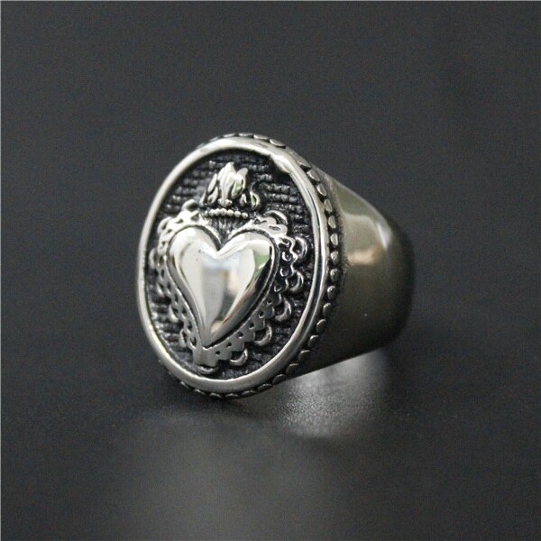 A Sacred Heart Ring by Rebel Saint Co with a heart on it.