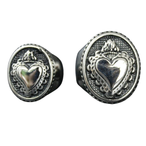 A Sacred Heart Ring by Rebel Saint Co with a heart on it.